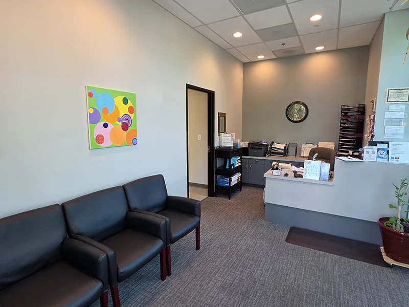 Reception desk and seating at Urgent Care Chiropractic in Des Moines