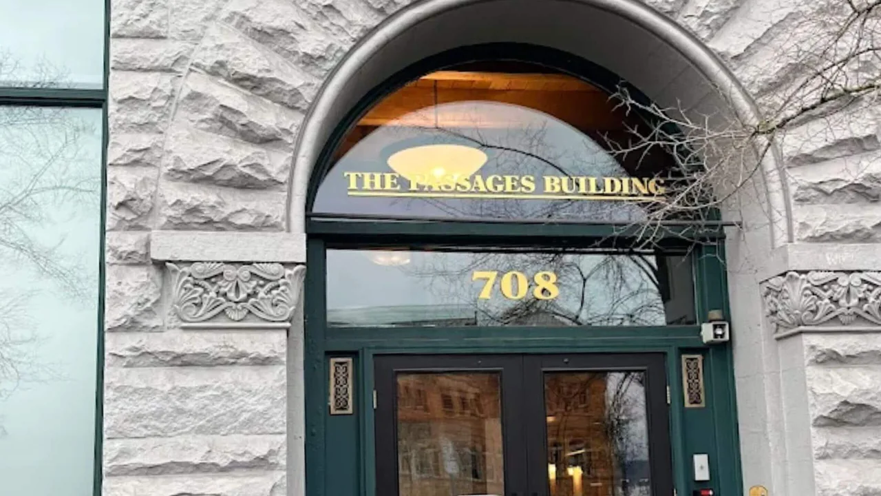 Arched entrance marked 708 at the building housing our Tacoma chiropractic clinic